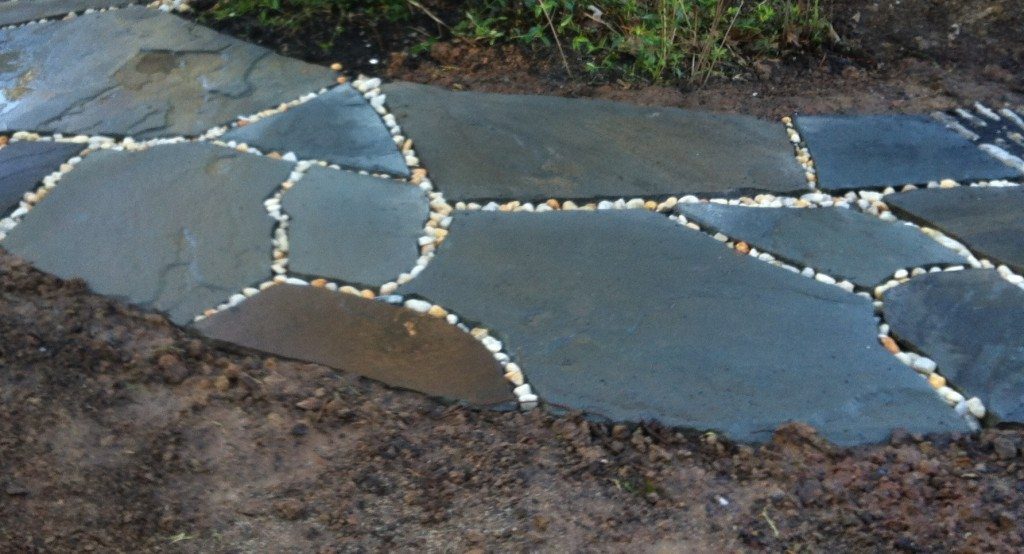 flagstone walkway with river rock