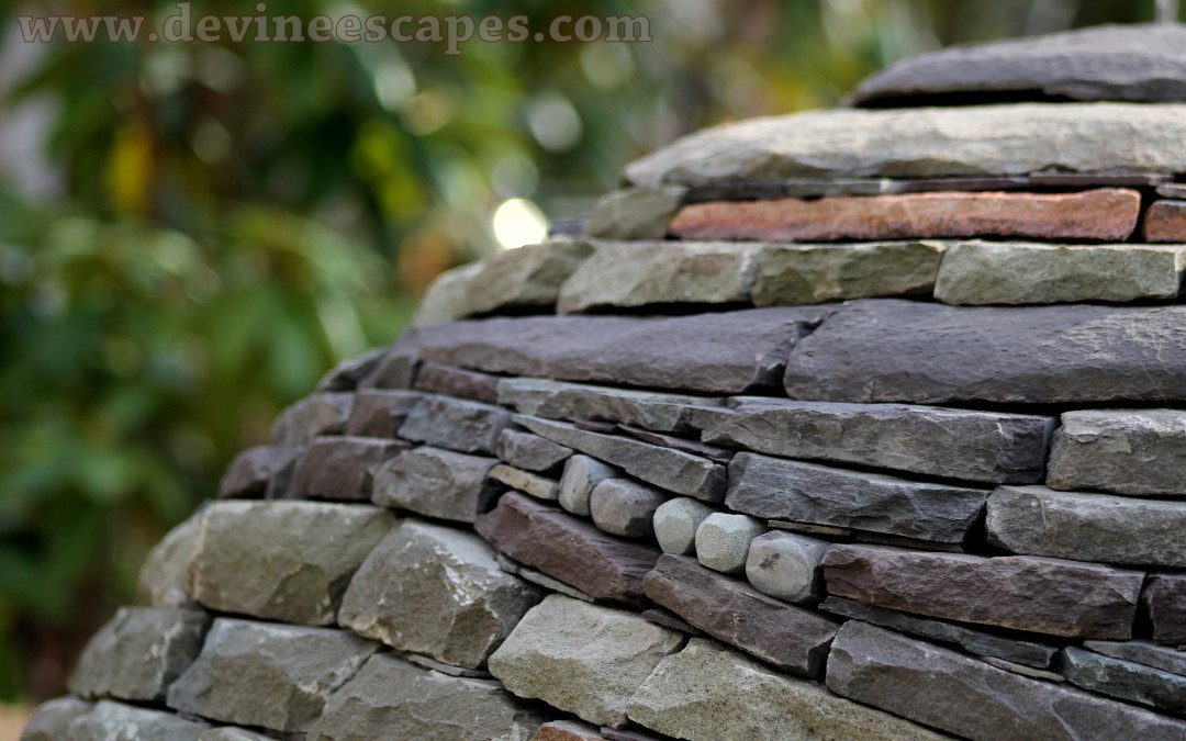 building another dry stone sphere garden sculpture