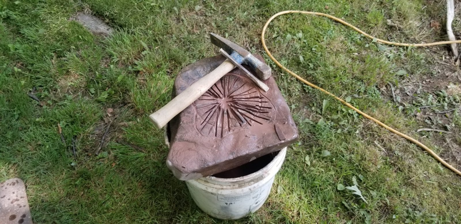 carving a stone birdbath