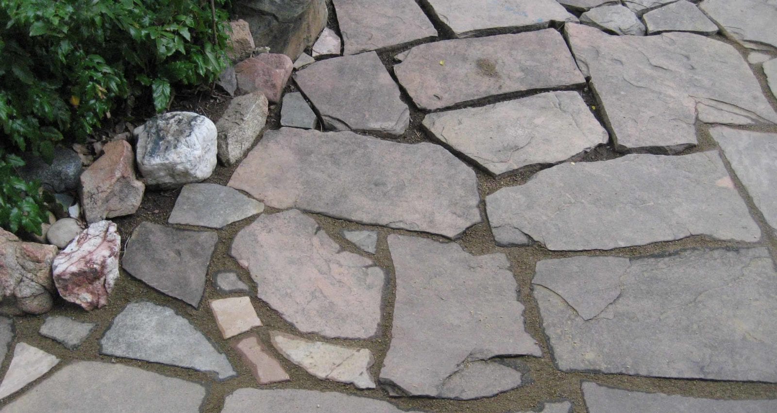 students work learning how to fit flagstone