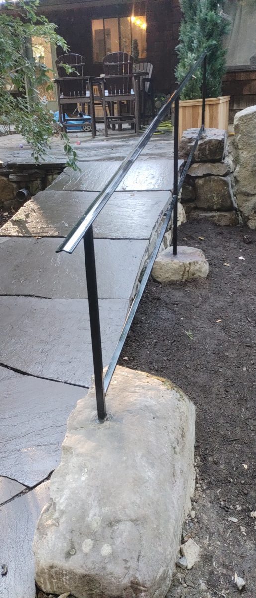 boulders set into hand rail